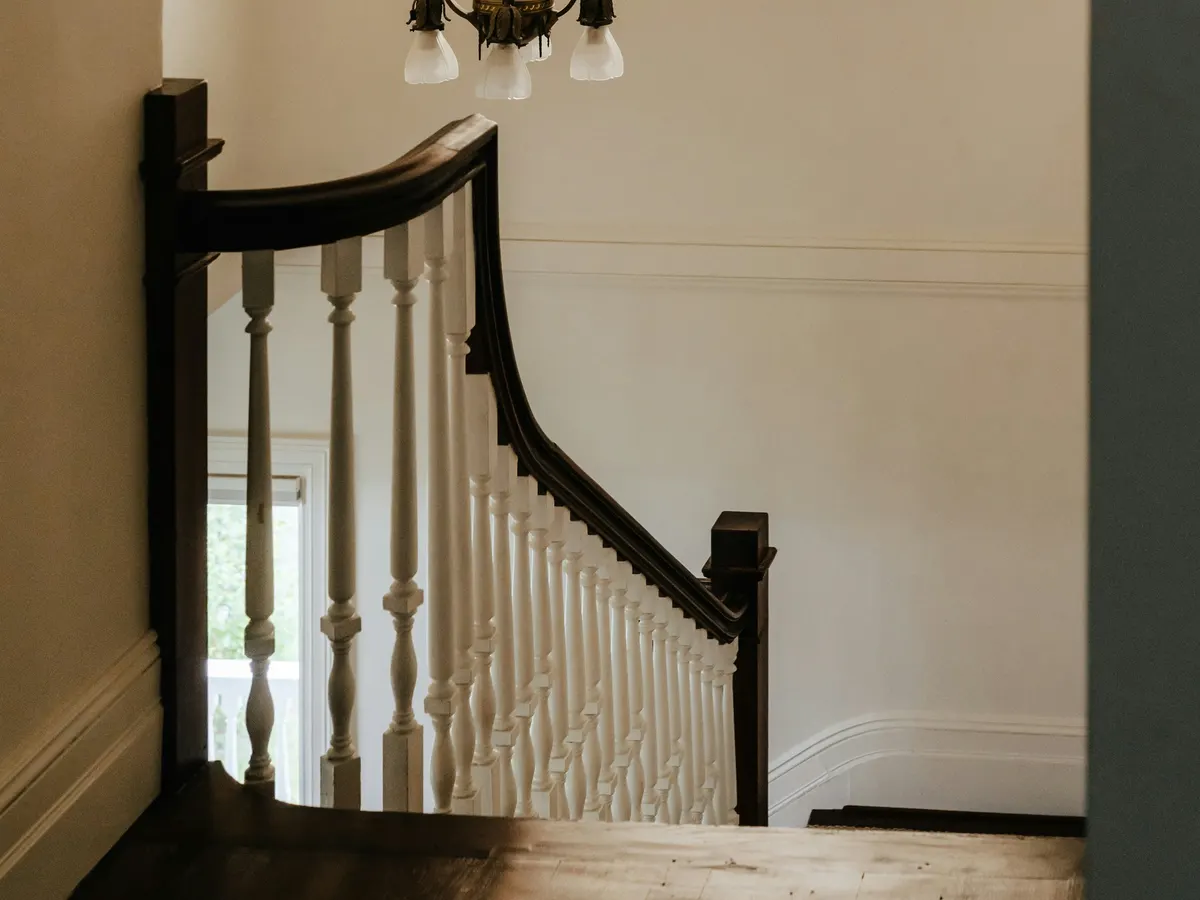 Architectrual balustrade. The graceful descent to the newelpost has been well executed.